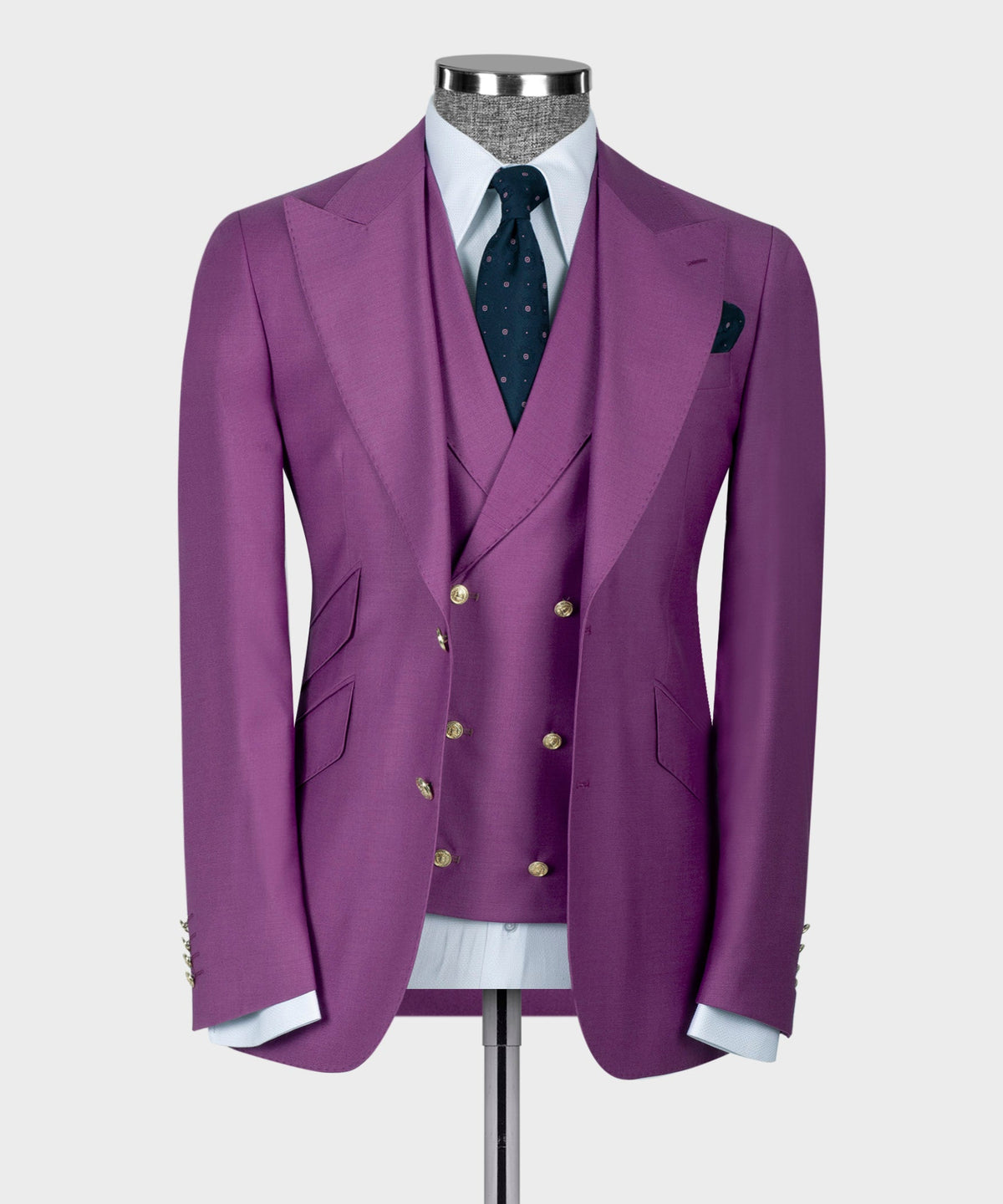 Purple suit jacket with gold buttons, dress shirt, dark patterned tie, and pocket square