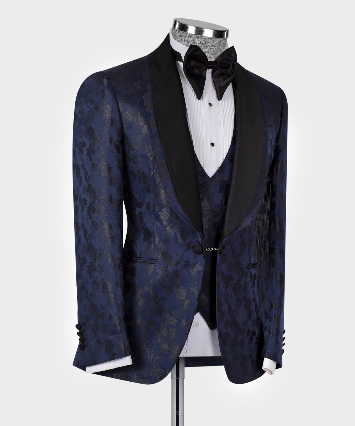 Navy tuxedo jacket with black satin double lapels and bow tie, side view