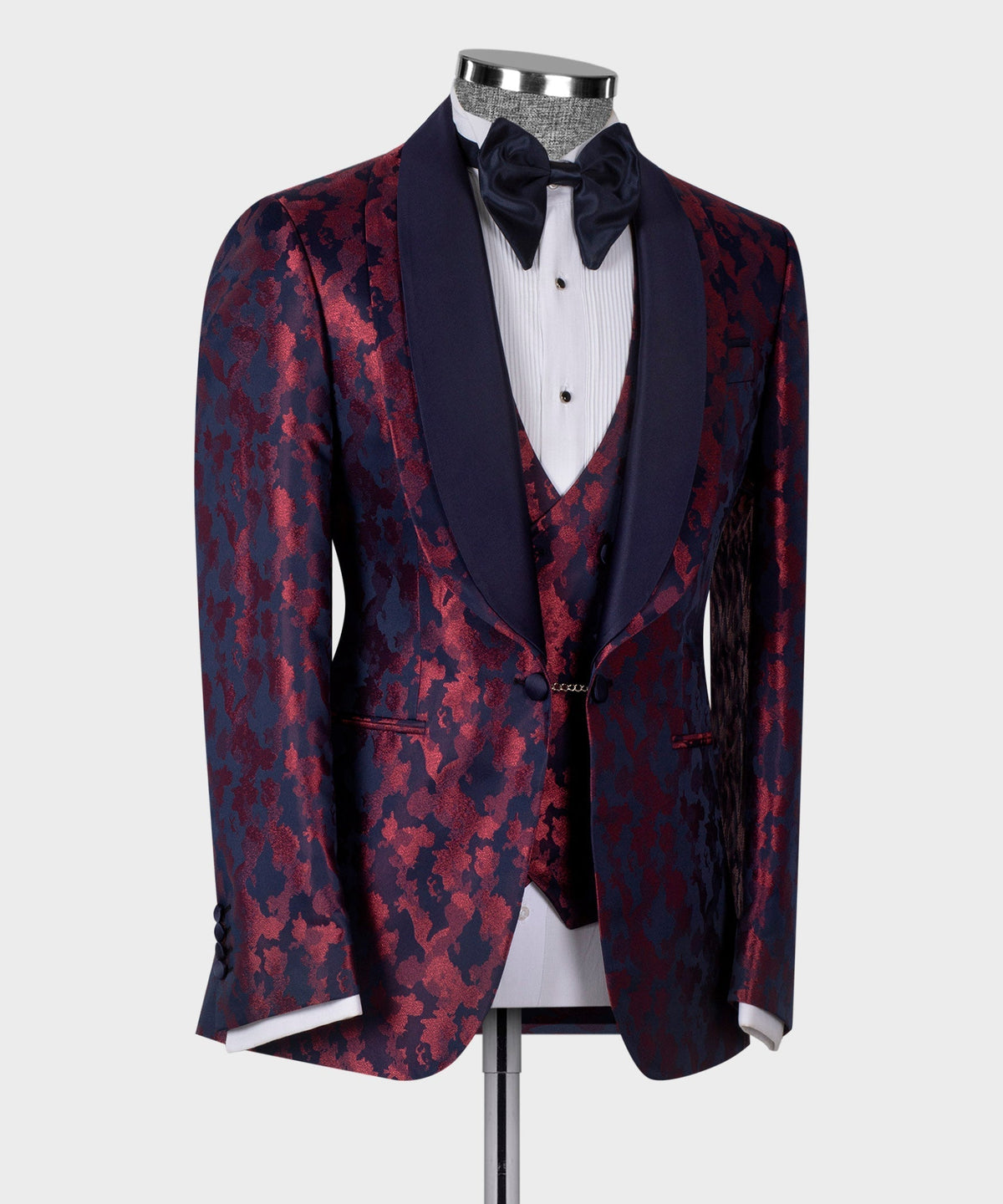 Double-lapel tuxedo jacket with burgundy patterned front panels and bow tie