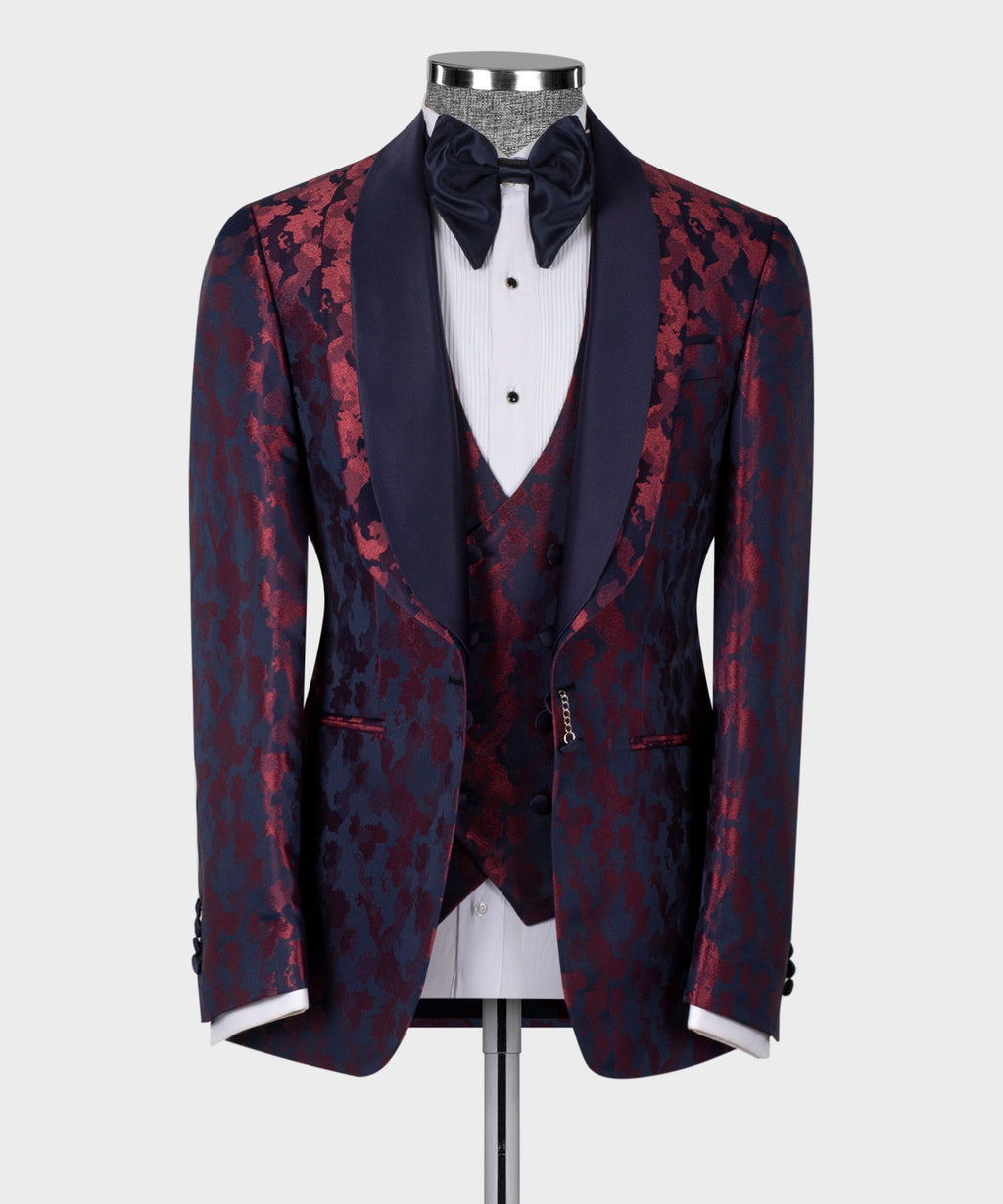Double-lapel tuxedo jacket with burgundy pattern over dark blue, paired with black bow tie