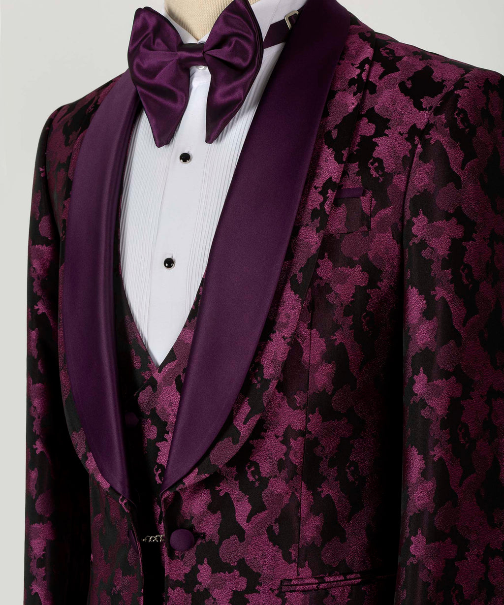 Close-up of purple bow tie and double satin lapels on patterned tuxedo jacket with waistcoat