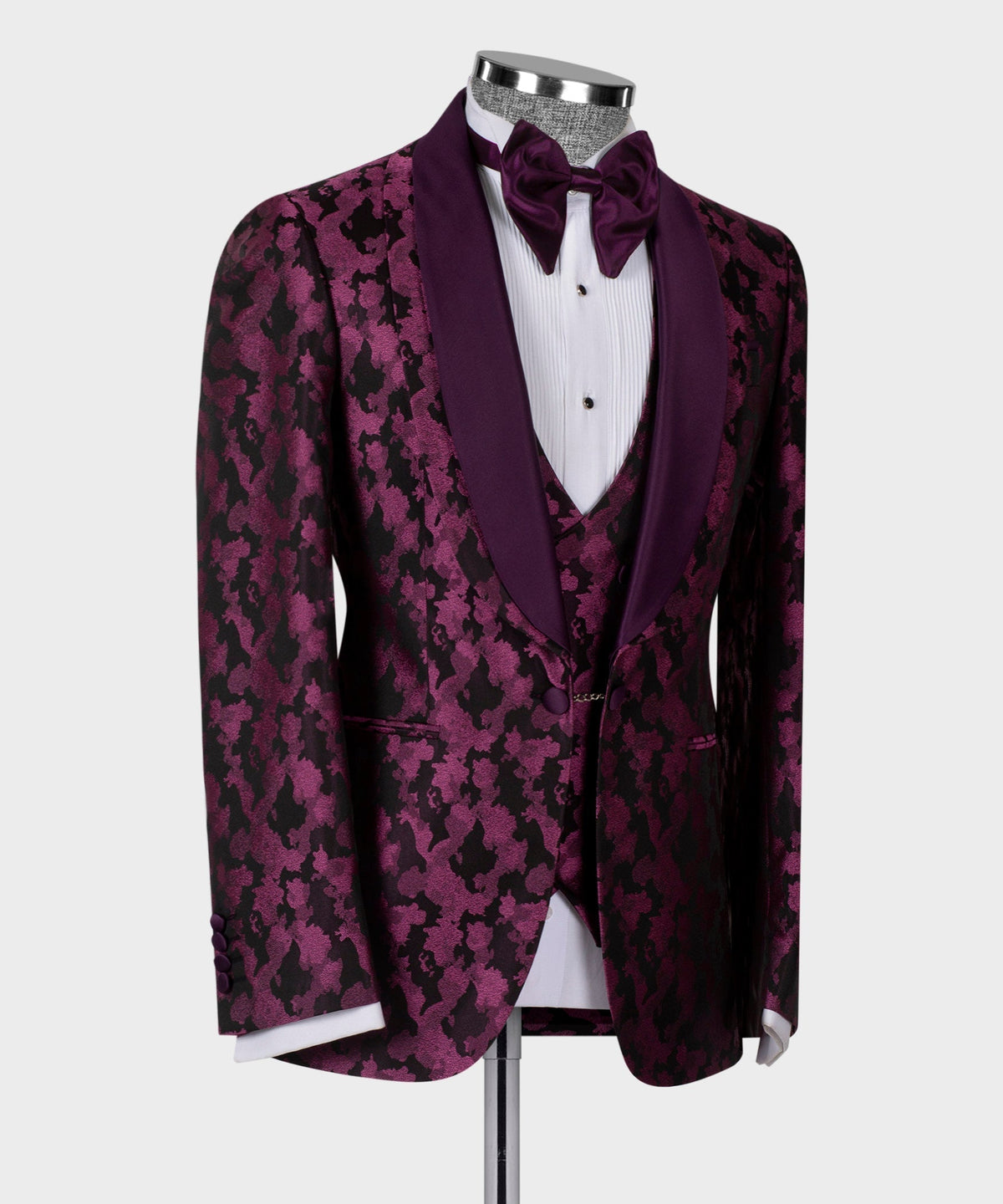 Close side of tuxedo jacket: purple patterned fabric with satin bow tie and waistcoat
