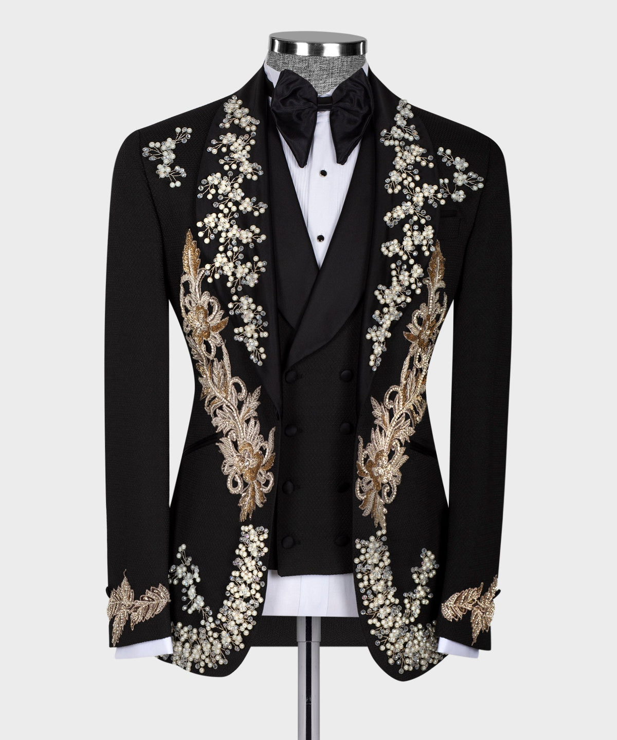 Black crystal tuxedo jacket with bow tie, pearl-and-gold floral embellishment on lapels