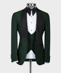 Green tuxedo jacket with black satin lapels, bow tie, and patterned waistcoat