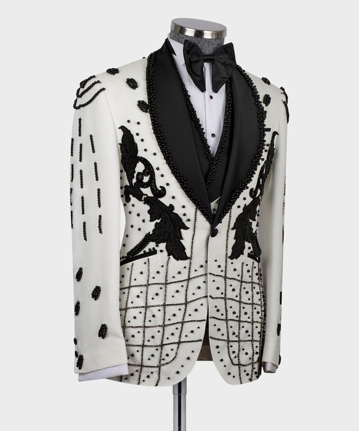 White tuxedo jacket with black floral appliqué and grid crystal embroidery