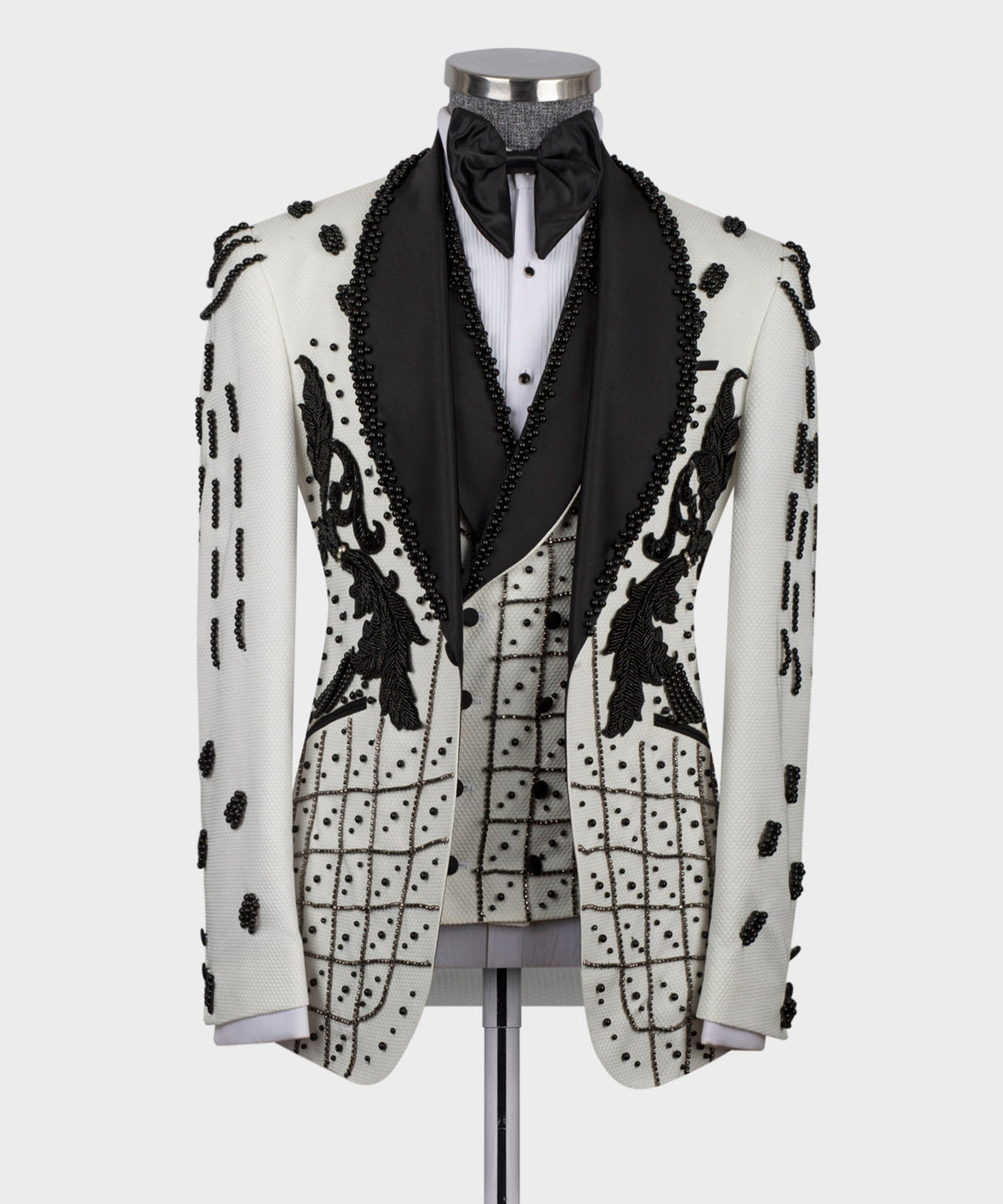 White silk tuxedo jacket with black satin lapels and crystal bead trim