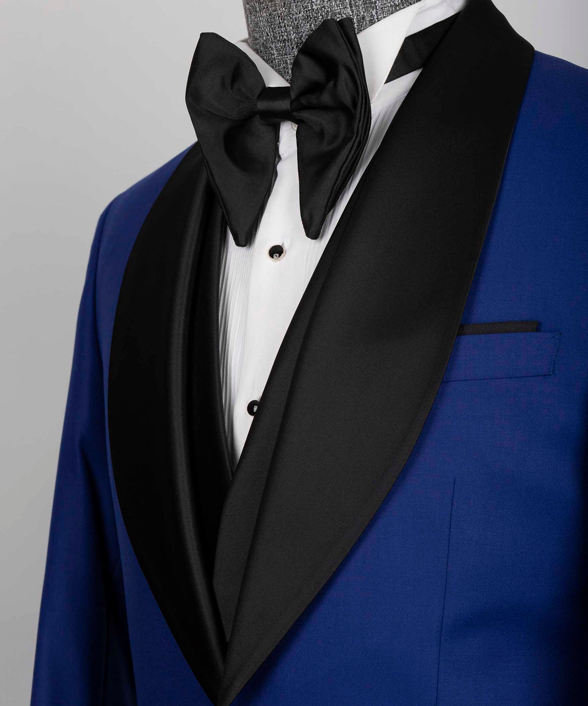 Close-up black satin tuxedo collar with black bow tie and tuxedo shirt