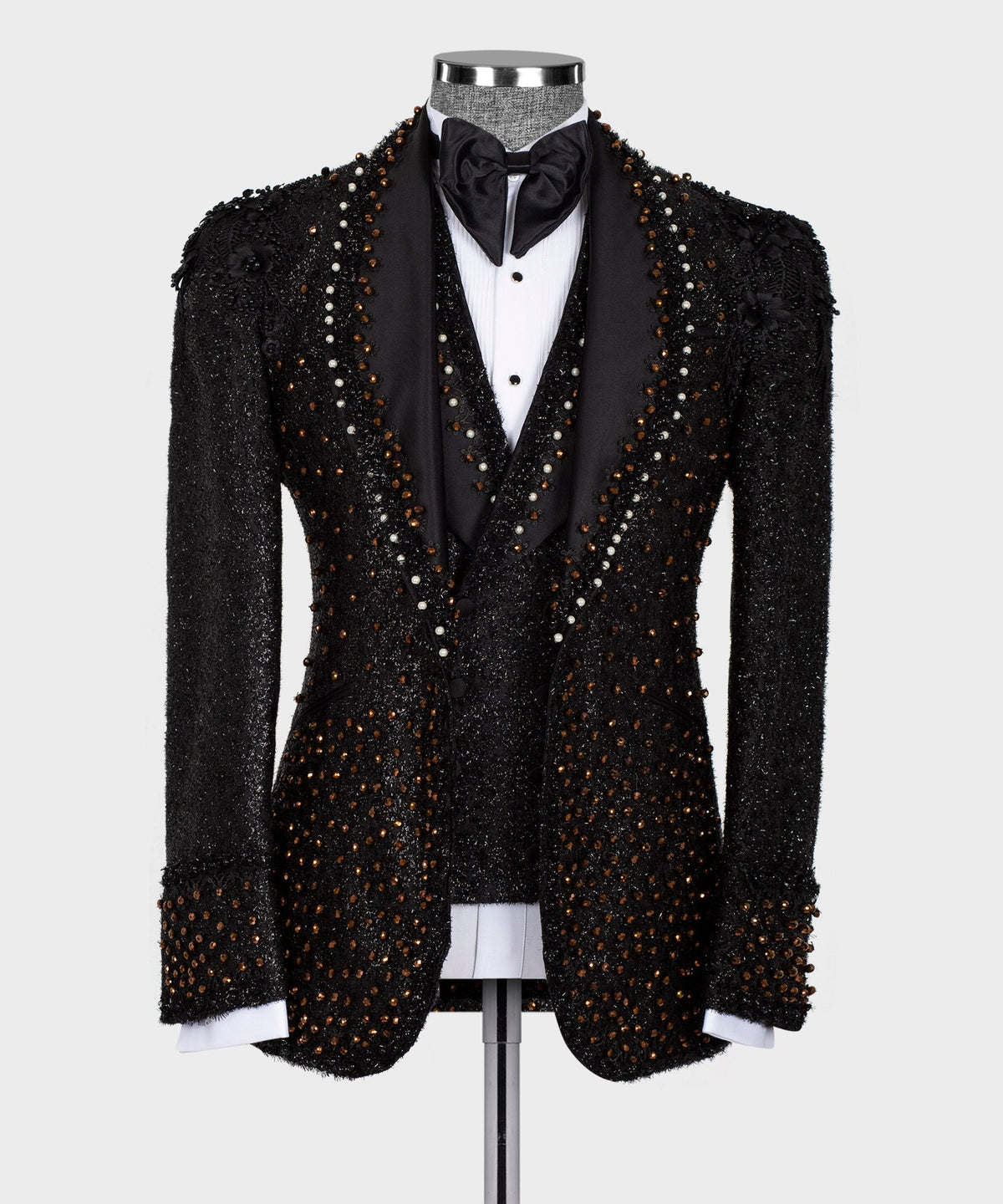 Black beaded tuxedo jacket with satin bow tie and white shirt panel on mannequin