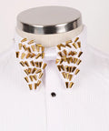 Koss Atelier white silk bow tie featuring gold spike stud embellishments on a pleated formal shirt.