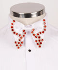 Koss Atelier white silk bow tie featuring intricate red crystal embellishments on a formal dress shirt.