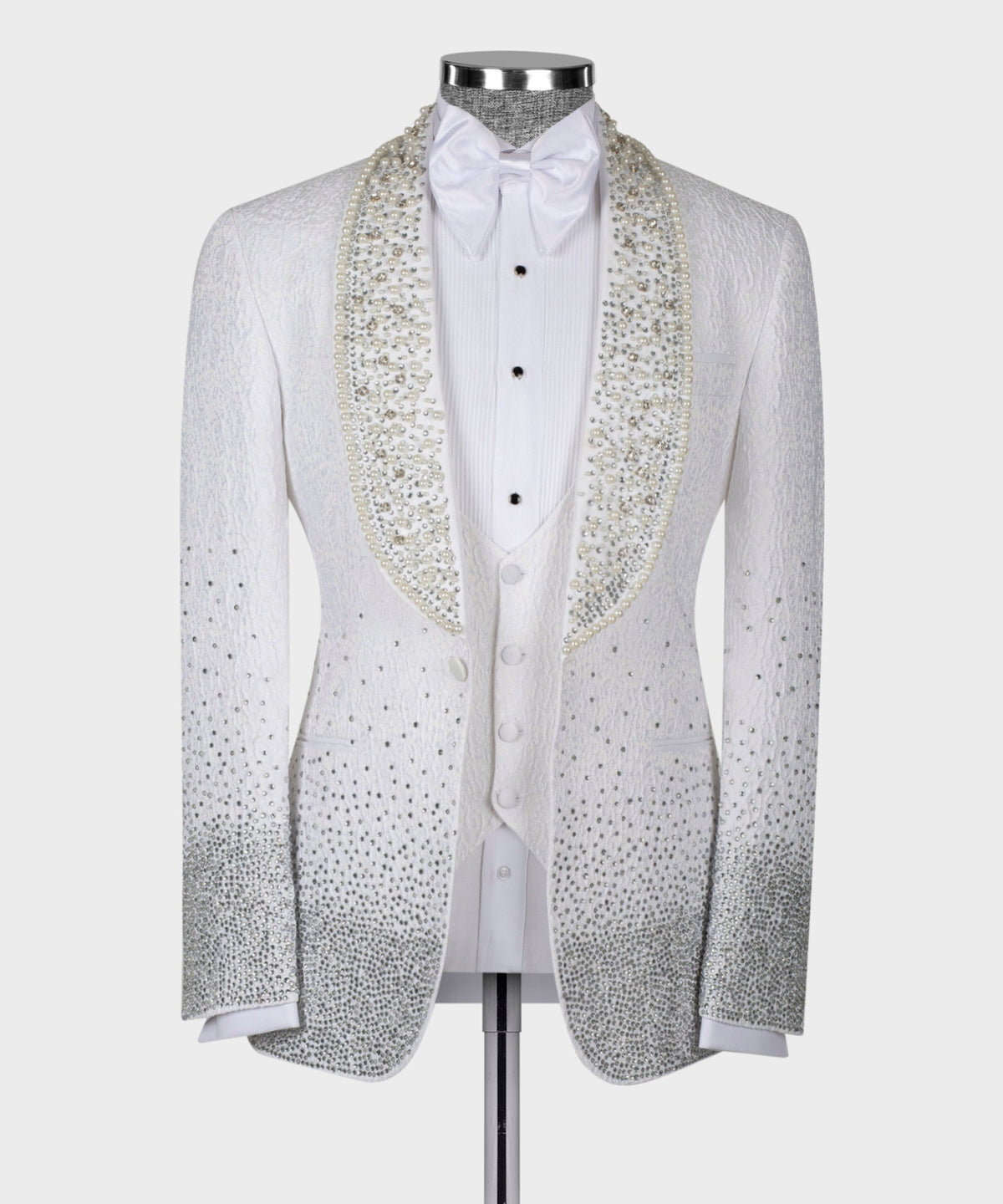White tuxedo jacket front with bow tie, gold embellished lapels, button placket