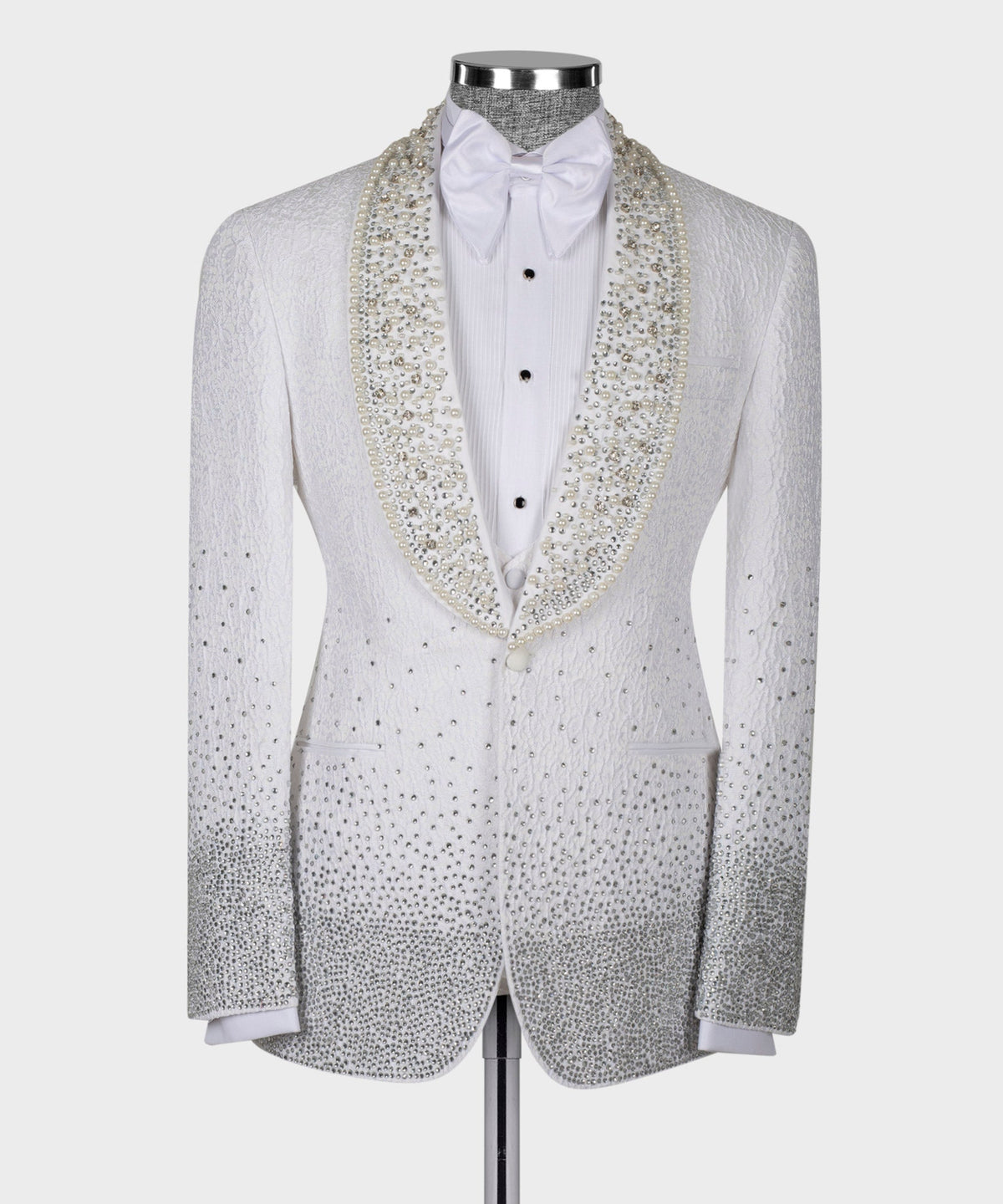 White tuxedo jacket with bow tie and gold jeweled trim on satin lapels