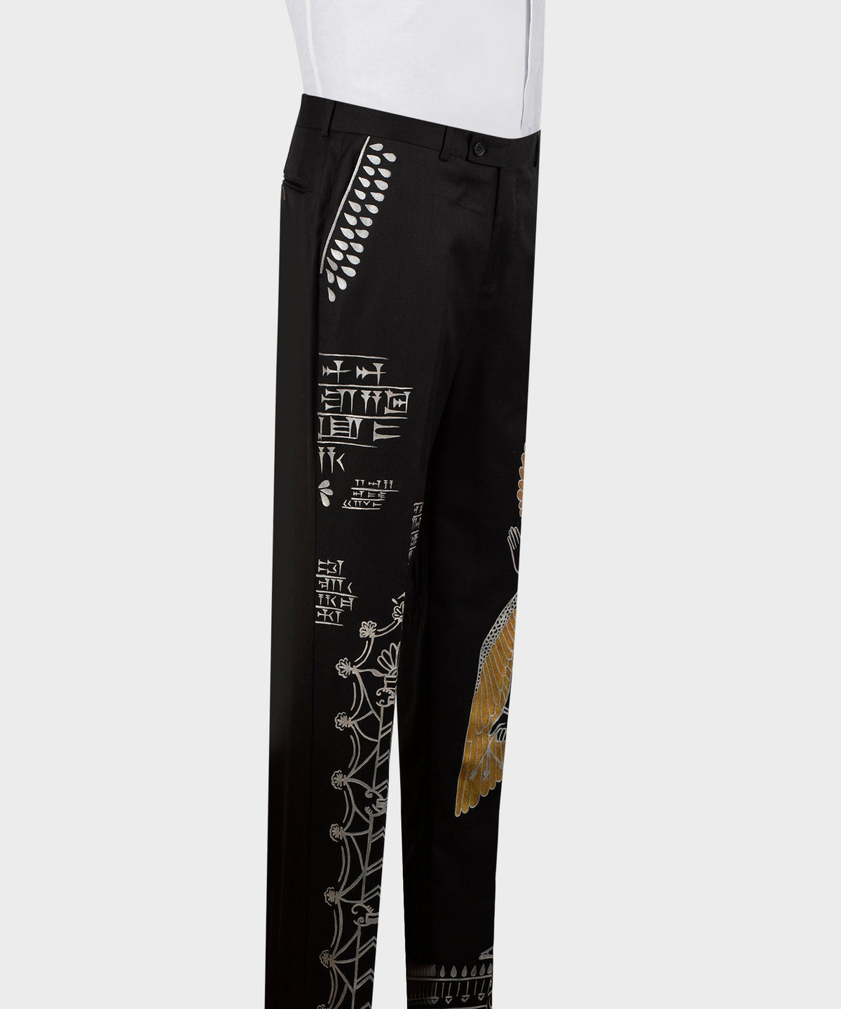 Black embroidered tuxedo trousers with white stitch designs along the side leg