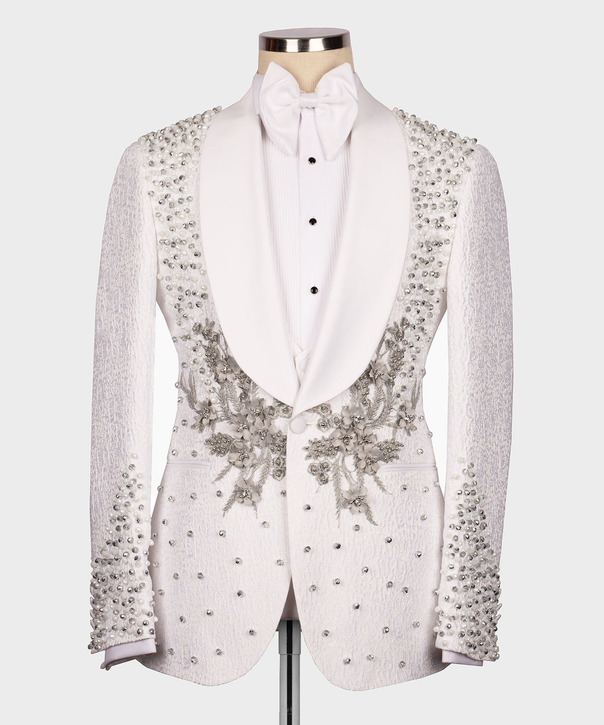 White tuxedo jacket with jeweled floral embellishments, black buttons, vest and bow tie set