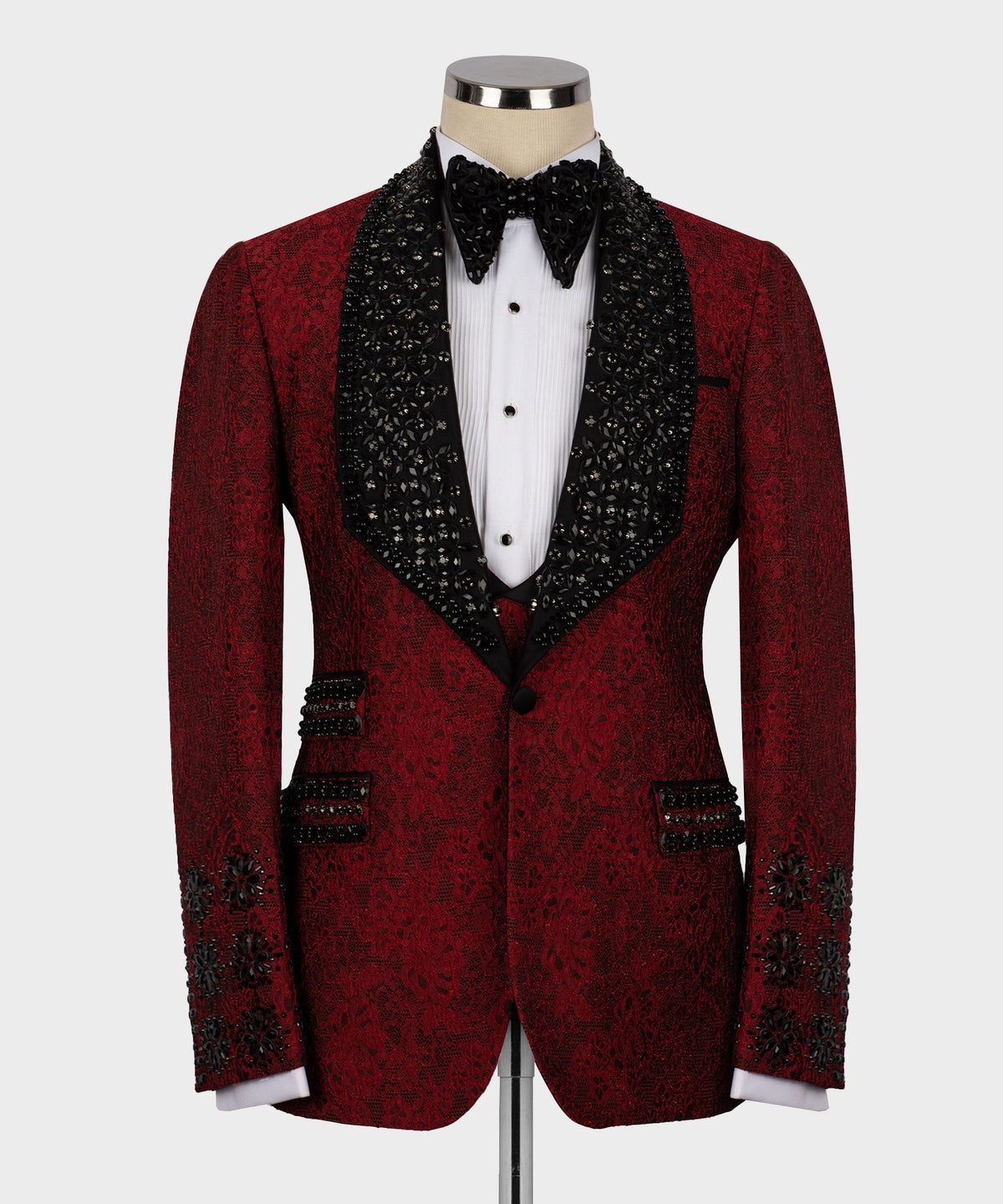 Red custom tuxedo jacket with black patterned satin lapels and bow tie