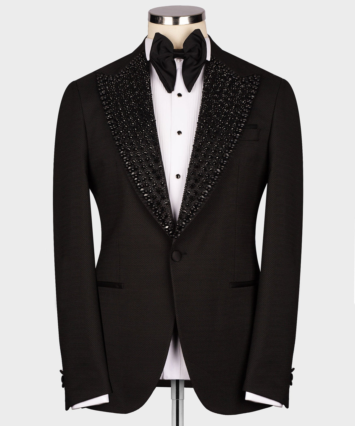 Black tuxedo jacket with gem-stone embellished shawl lapel and black bow tie
