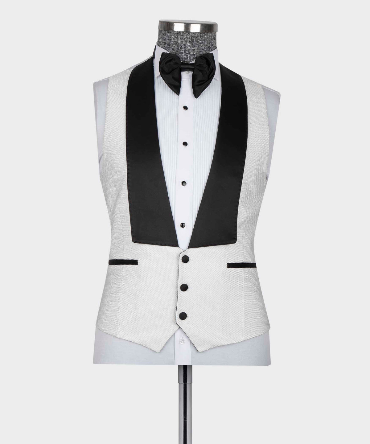 White tuxedo vest and jacket with black satin lapel accents and bow tie