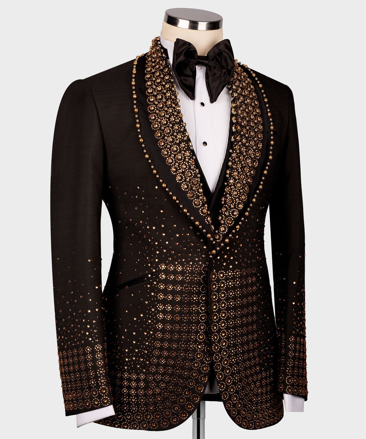 Black tuxedo jacket with gold gem-like detailing along lapels and chest, front view
