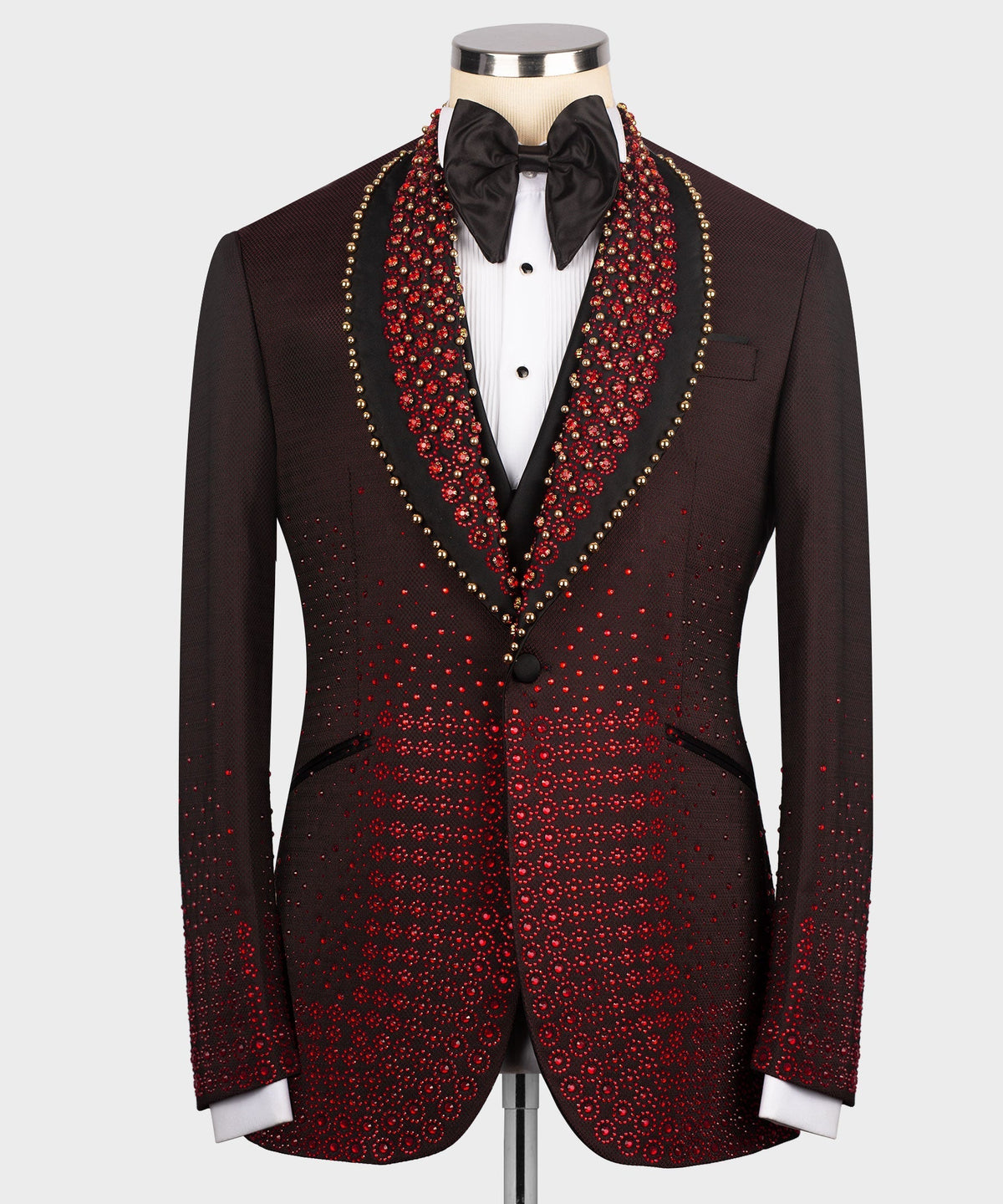 Burgundy tuxedo jacket with red jeweled pattern, black lapels, and bow tie