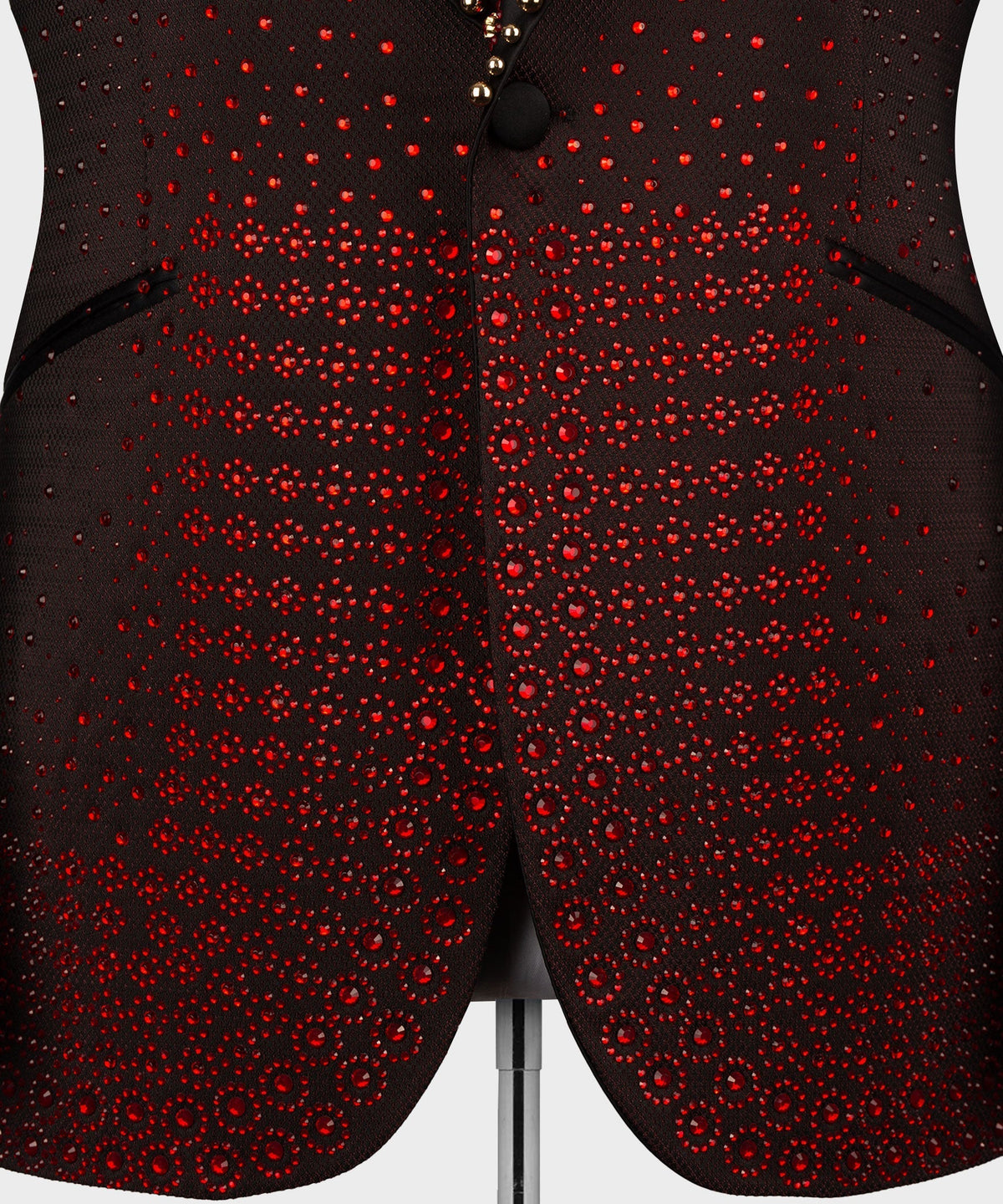 Burgundy tuxedo front with red circular jeweled studs and black center button
