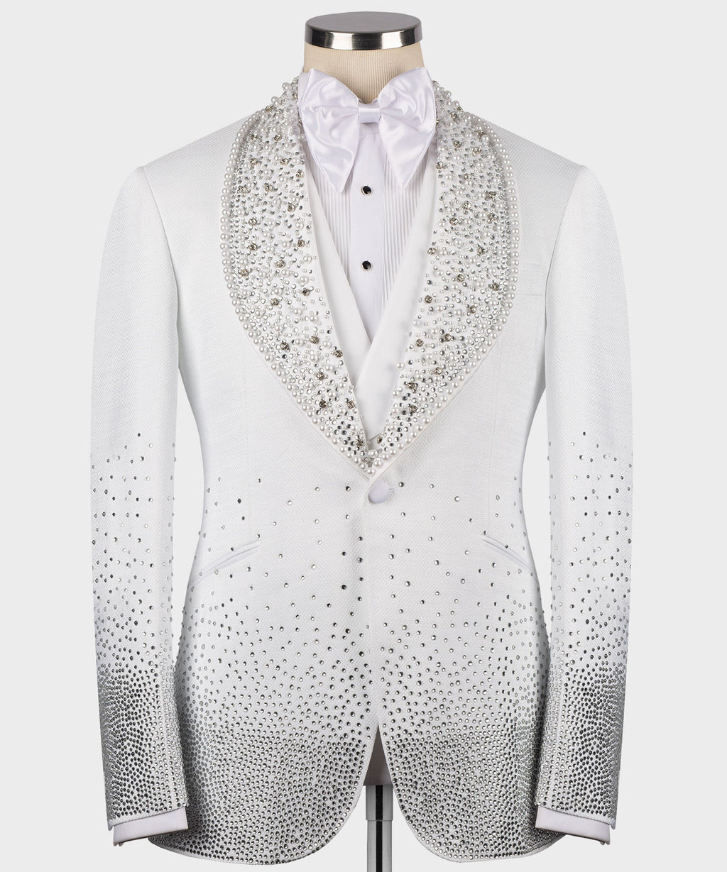 White tuxedo jacket with jewel-studded lapels, bow tie, and button front