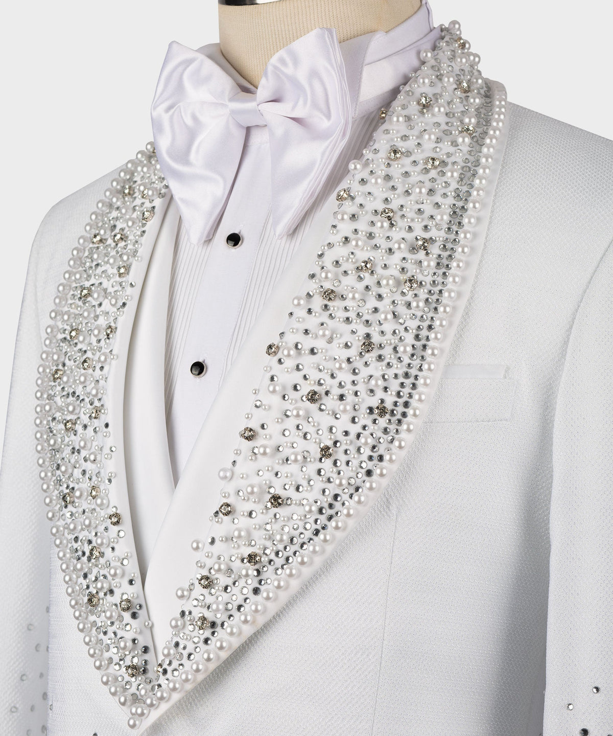 White tuxedo shirt with bow tie and rhinestone-studded lapel detail