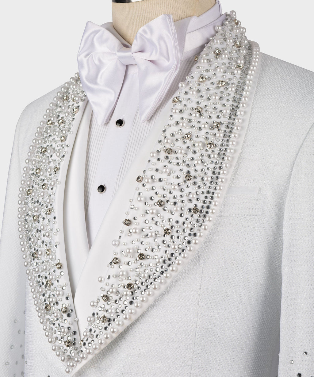 White satin bow tie with jeweled lapel detail on a white tuxedo jacket