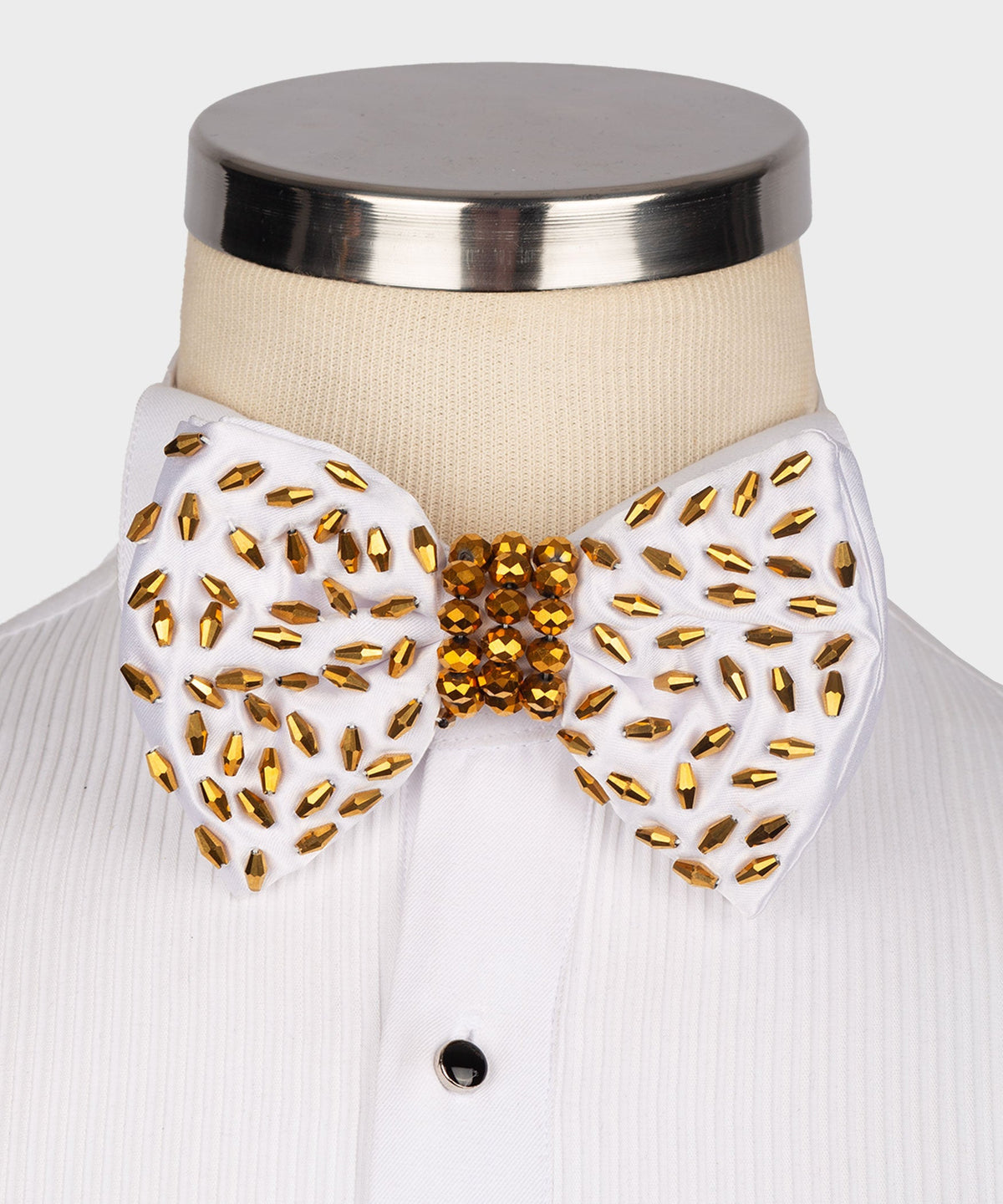 White beaded bow tie with gold and red faceted stones, round center cluster