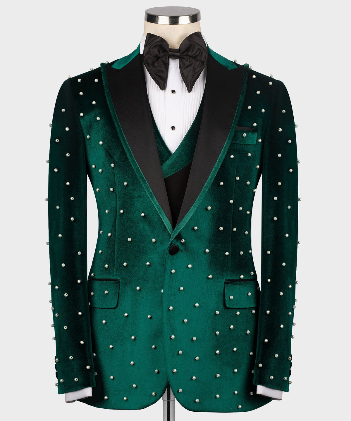 Green velvet tuxedo jacket with pearl-like stud trim and notch lapels