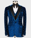 Blue velvet tuxedo jacket with pearl-studded trim and chest pockets