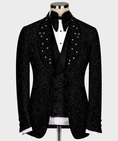 Black glitter tuxedo jacket with rhinestone accents and satin lapels, white shirt front