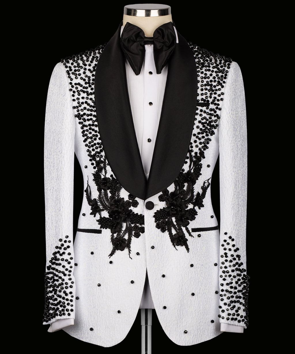 White tuxedo jacket with black floral embroidery, bead-dotted pattern and satin lapels