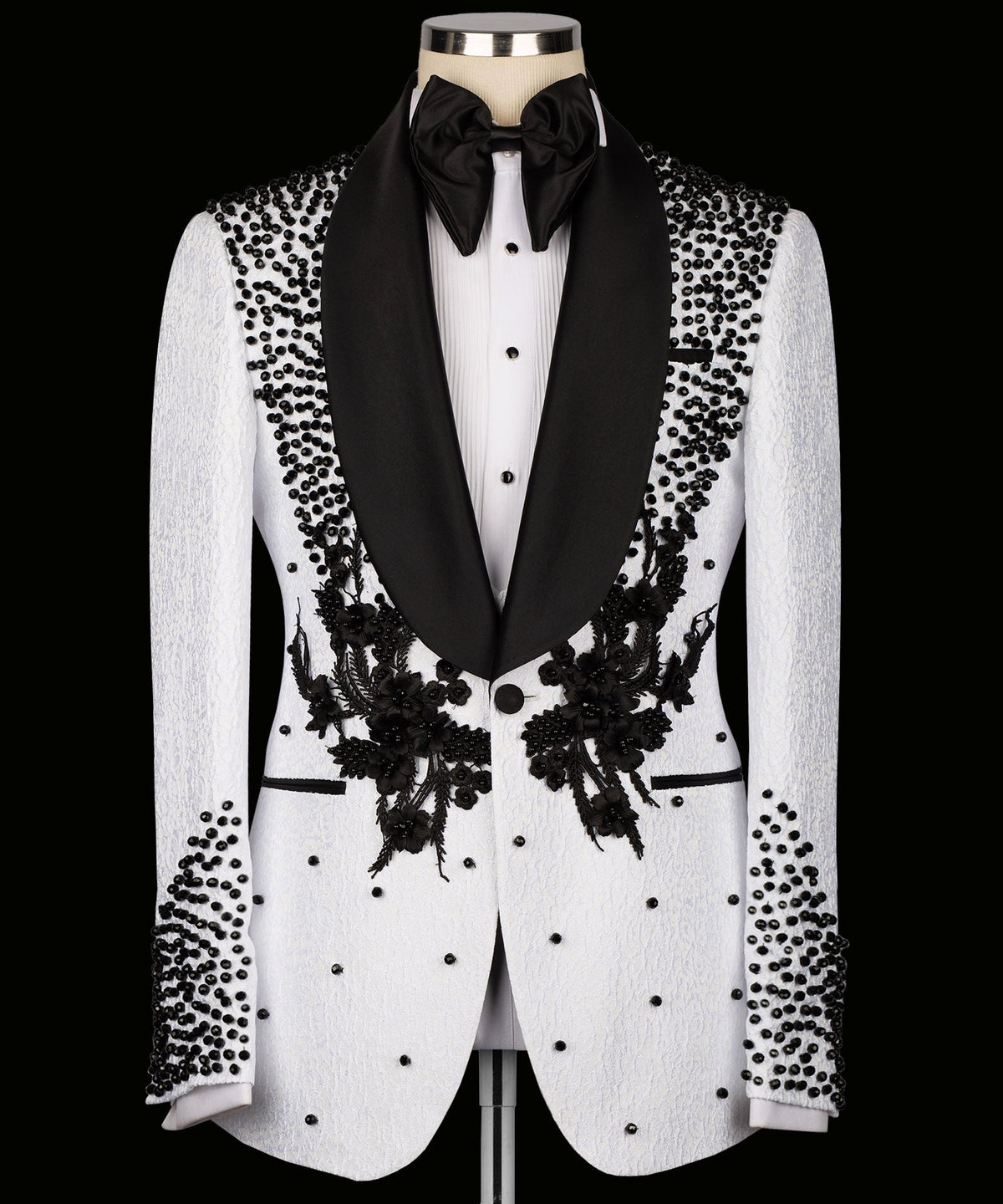 White tuxedo jacket with black floral embroidery, bead-dotted pattern and satin lapels