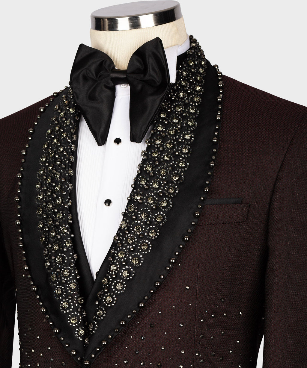 Black satin bow tie with white shirt and burgundy tuxedo lapels covered in gold-toned beads