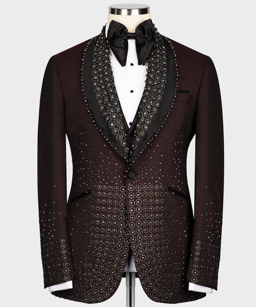 Burgundy tuxedo jacket with round lapels, black satin trim, and gold jeweled pattern
