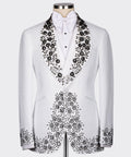 White tuxedo jacket with black gemstone-style embroidery on satin lapels and chest