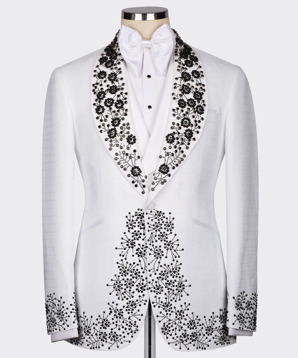 White tuxedo jacket with black gemstone-style embroidery on satin lapels and chest