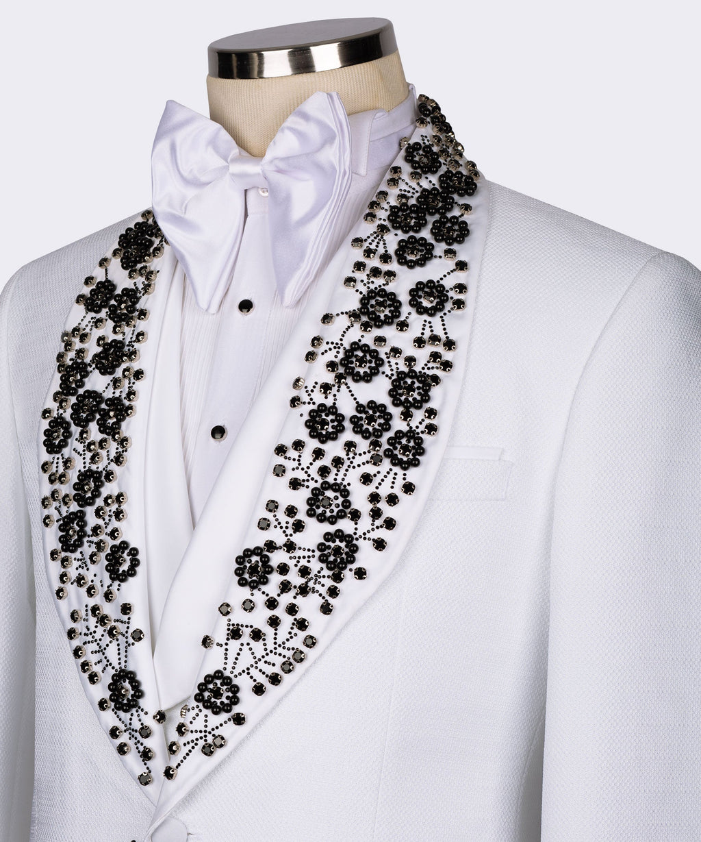 White bow-collar tuxedo jacket with black beaded gemstone embroidery on lapels