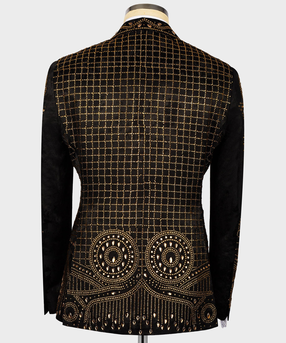 Black tuxedo jacket back with gold grid and circular embroidered motifs