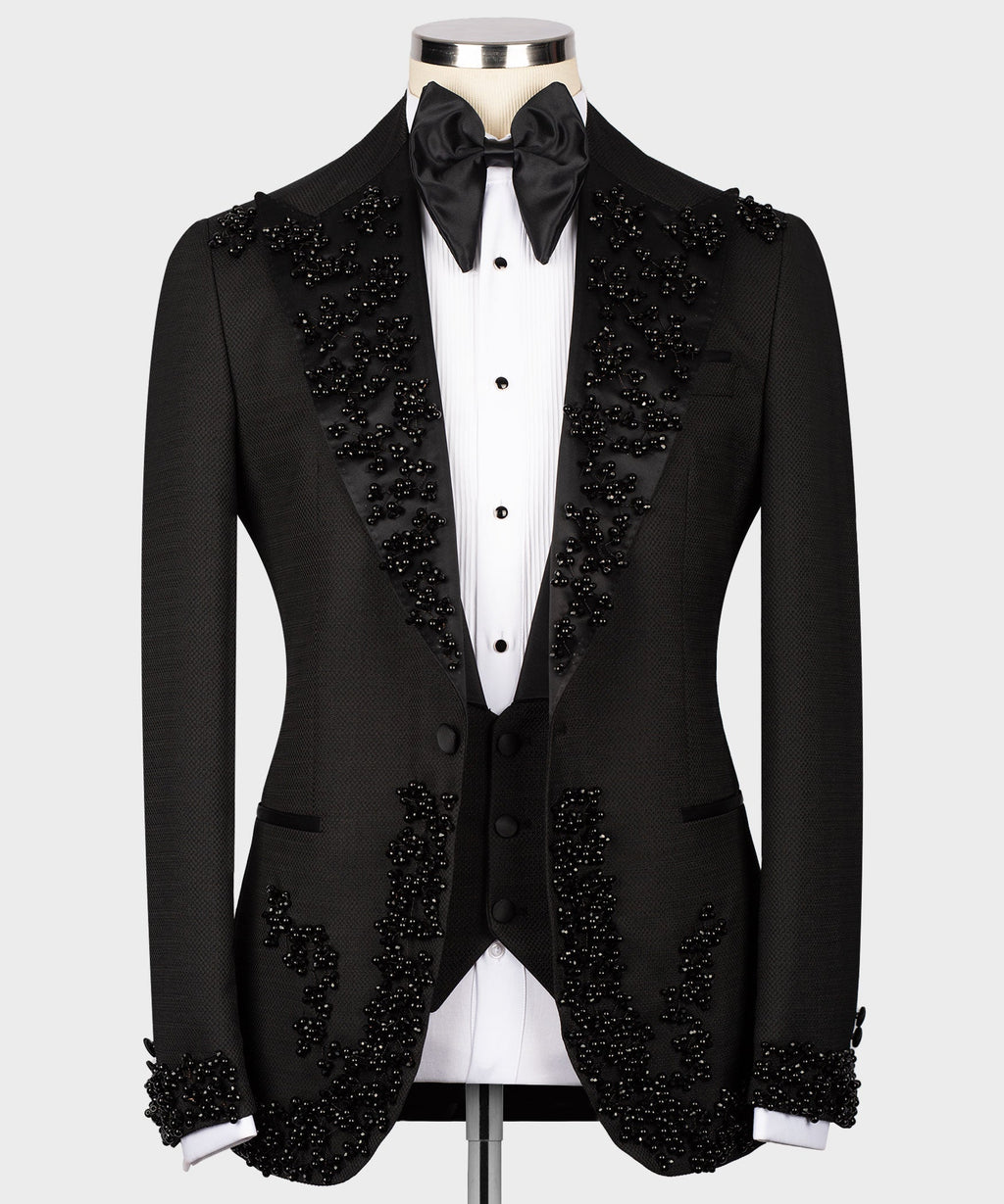 Black tuxedo jacket and vest with scattered rhinestone detailing and satin bow tie