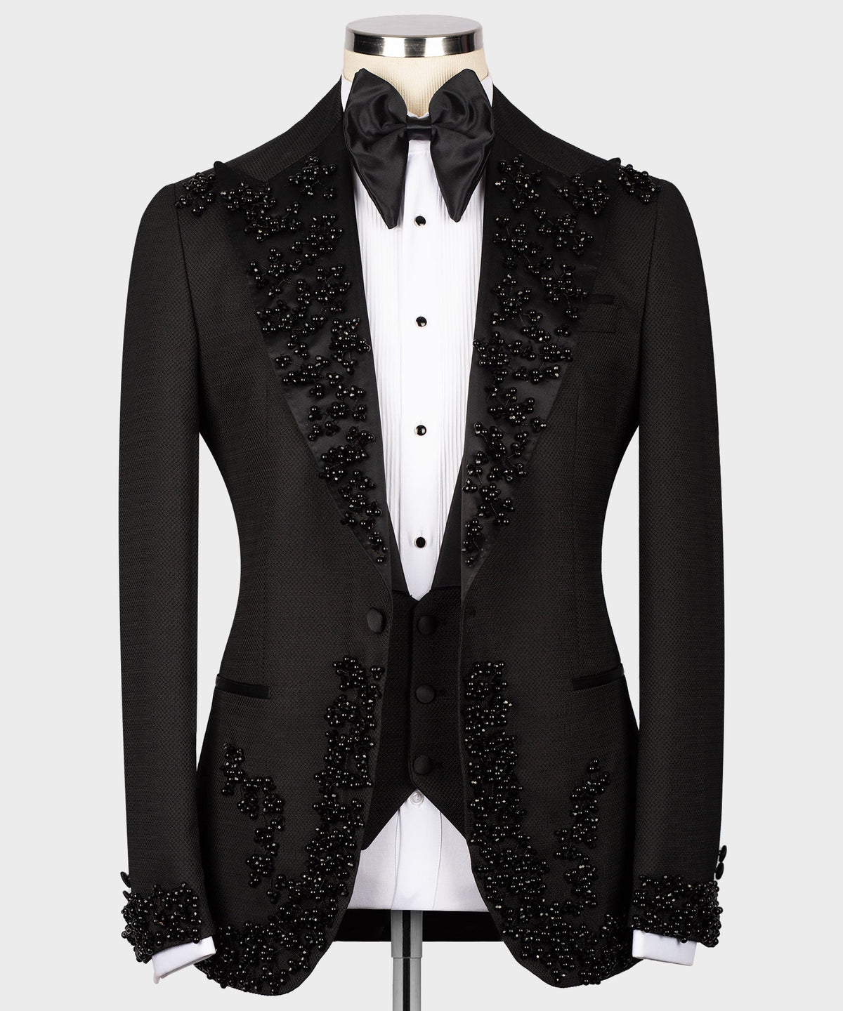 Black tuxedo jacket and vest with scattered rhinestone detailing and satin bow tie