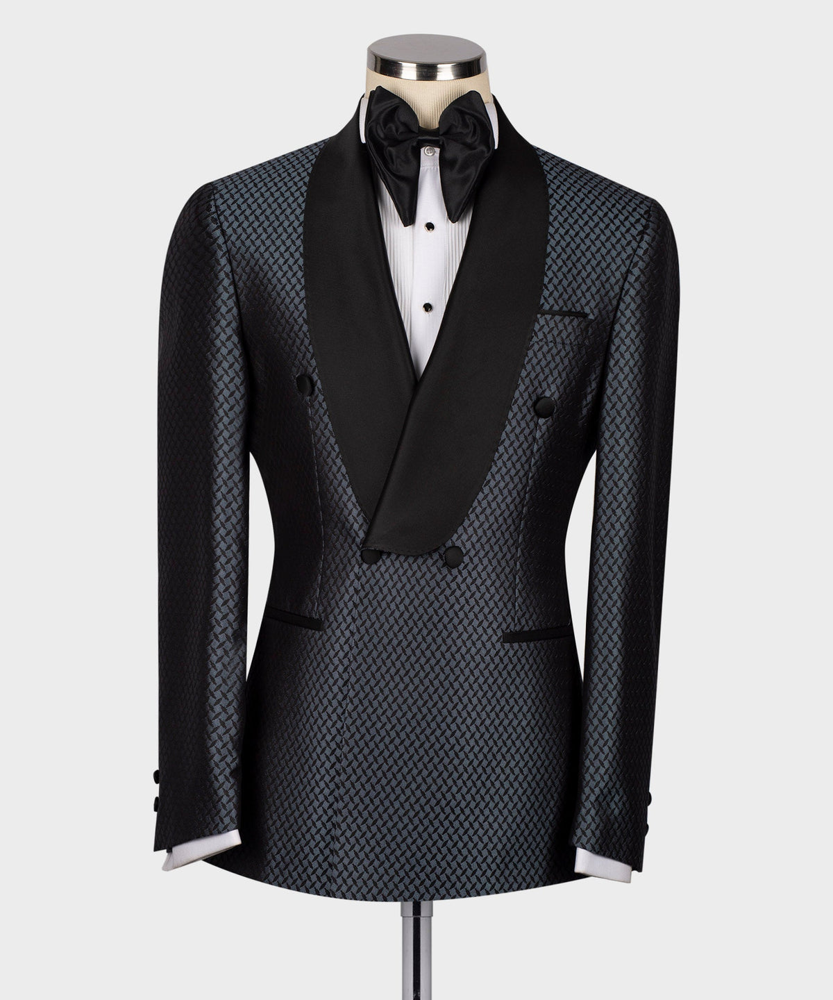Black tuxedo jacket with blue geometric pattern, satin lapels and black bow tie