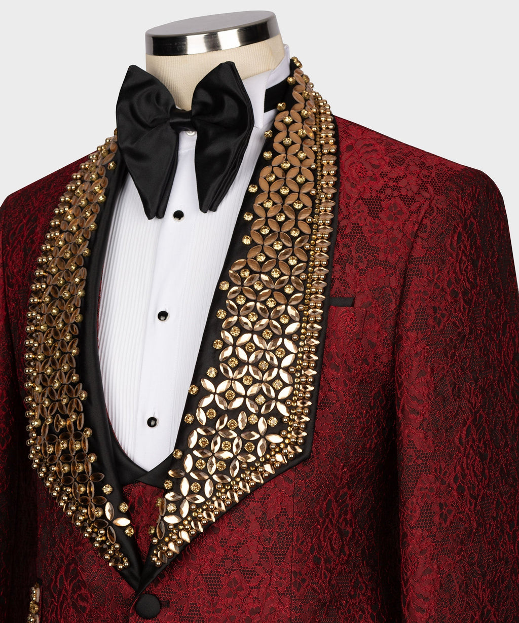 Close-up of red tuxedo with gold gem-like lapel trim, black bow tie and white shirt