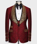 Red silk tuxedo jacket with gold jeweled lapels, black bow tie, white shirt and vest
