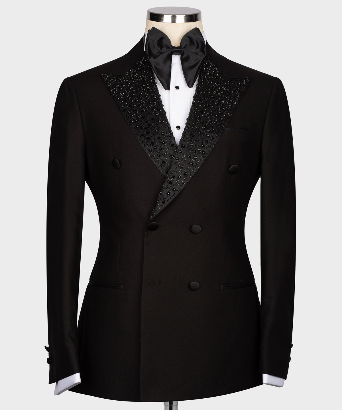 Black tuxedo jacket with gemstone-embroidered satin lapels, double-breasted buttons