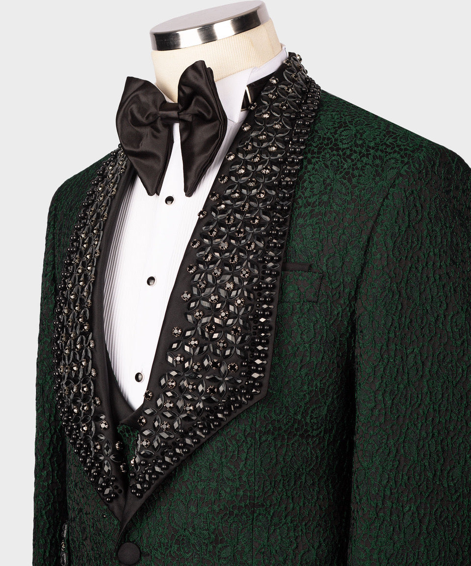 Close-up: dark green tuxedo jacket with black satin bow tie and beaded vest