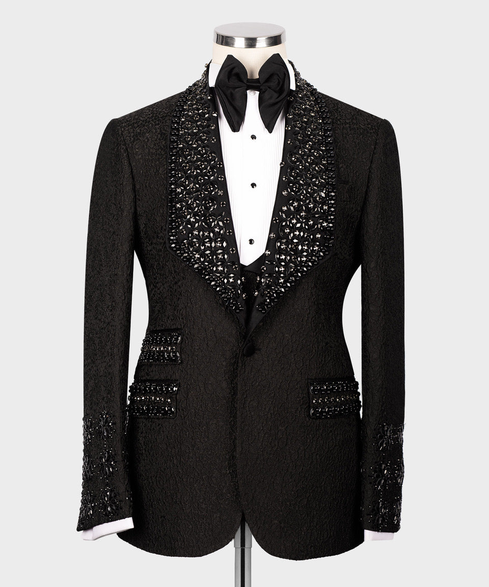 Black tuxedo jacket with bow tie and jeweled vest detailing