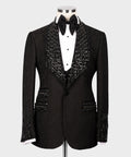 Black tuxedo jacket with bow tie and jeweled vest detailing