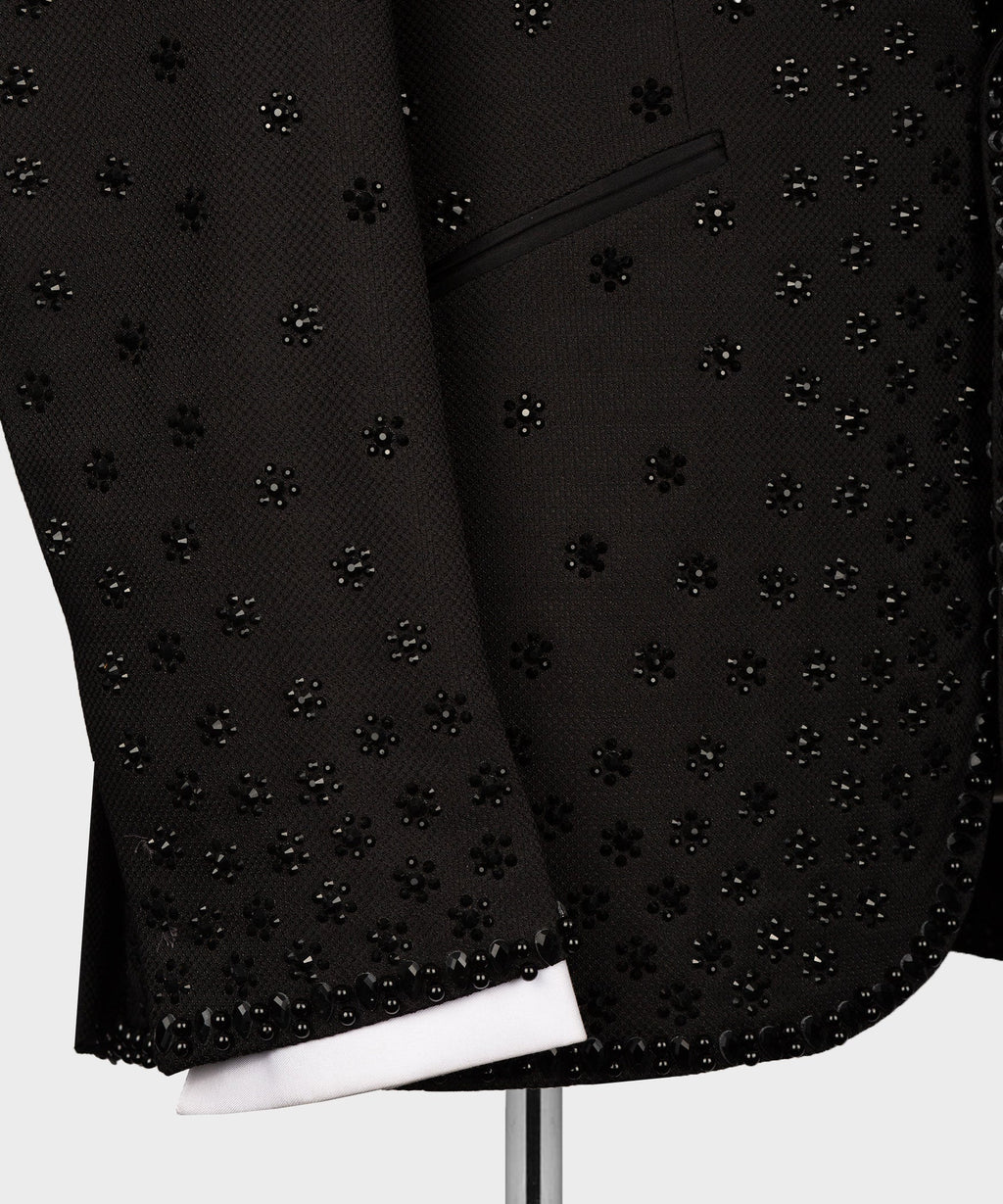 Black tuxedo jacket lower front with dense rhinestone pattern