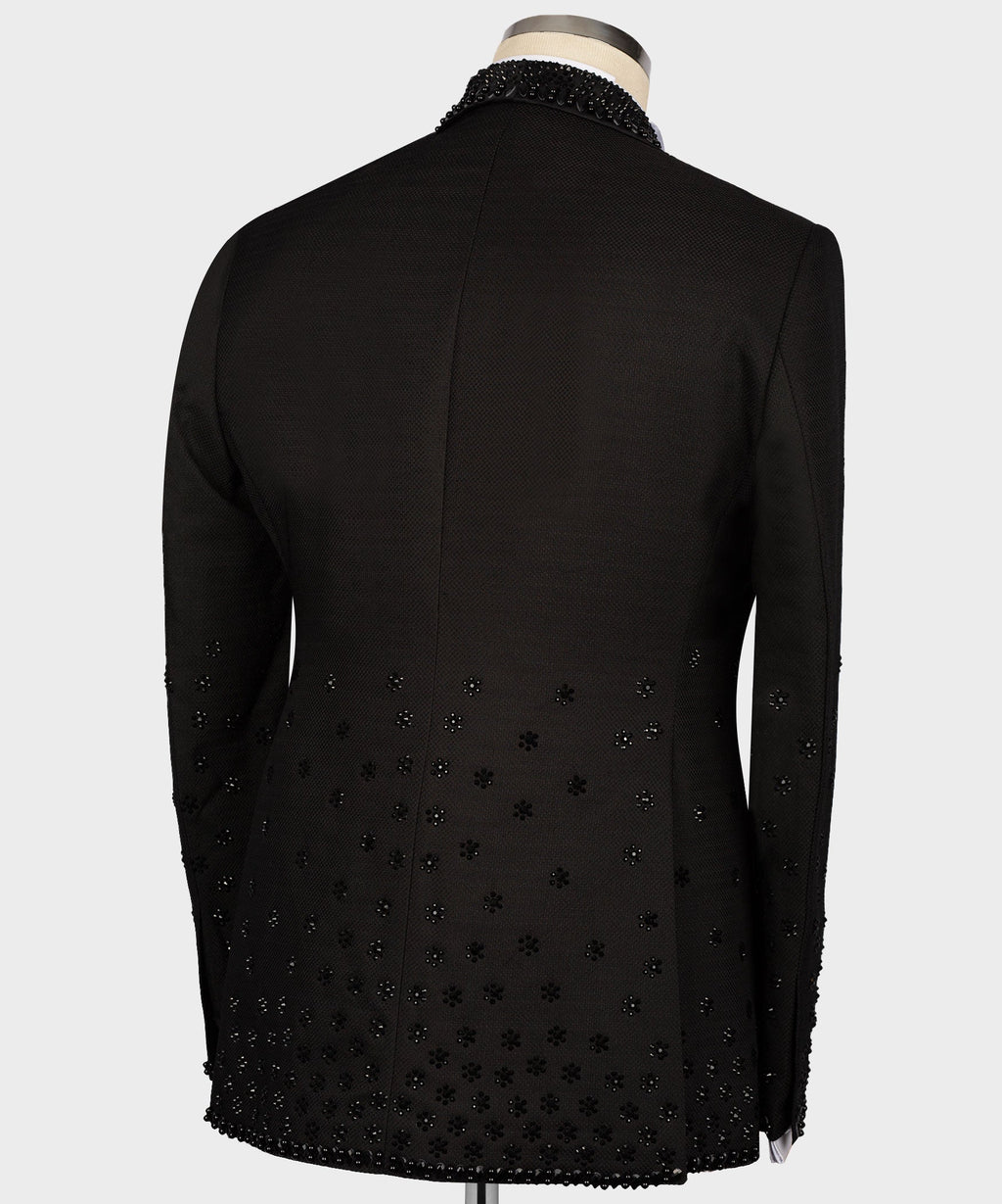Black tuxedo jacket back view with scattered jeweled sequin accents on fabric